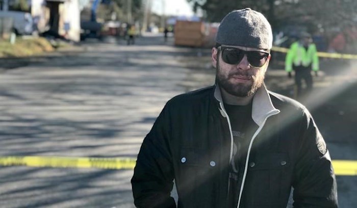  John Newton, 28, is seen behind police tape in Maple Ridge, B.C., on Saturday, March 2, 2019. Newton says he was the last resident to leave the “Anita Place” homeless camp in Maple Ridge, B.C., when police and firefighters enforced an evacuation order Saturday and cordoned off the area. THE CANADIAN PRESS/Amy Smart