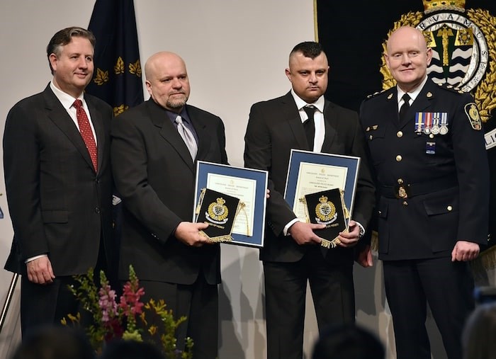  Joe De Jesus and Irfan Elahi, with VPD Chief Adam Palmer and Mayor Kennedy Stewart, were awarded VPD Awards of Merit for their actions on the face of an armed man trying to get a gun at the Canadian Tire store on Bentall Street in November 2016. Photo Dan Toulgoet