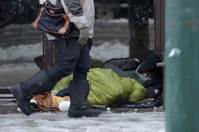  Vancouver's annual homeless count begins Tuesday night and continues through all city neighbourhoods over the following 24 hours. A homeless man sleeps in a doorway in Vancouver's Downtown Eastside, Monday, Dec. 19, 2016. THE CANADIAN PRESS/Jonathan Hayward