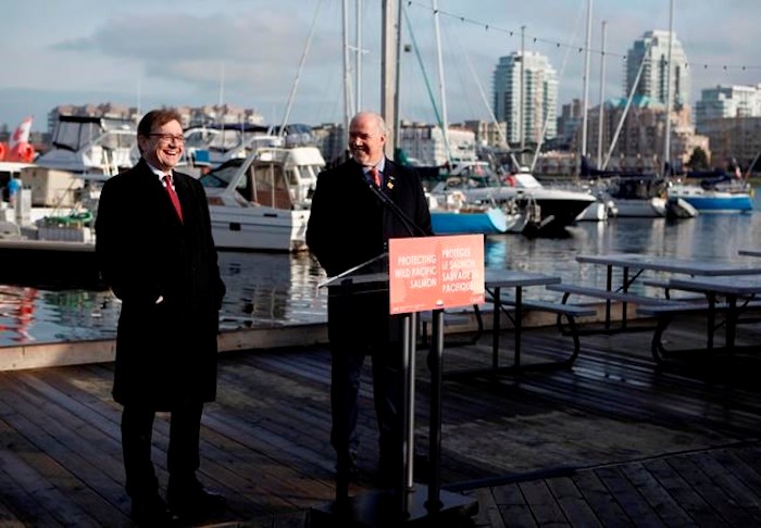  Premier John Horgan and federal Minister of Fisheries Jonathan Wilkinson make an announcement about the Salmon Restoration and Innovation Fund during a press conference at Fisherman's Wharf in Victoria, B.C., on Friday, March 15, 2019. THE CANADIAN PRESS/Chad Hipolito