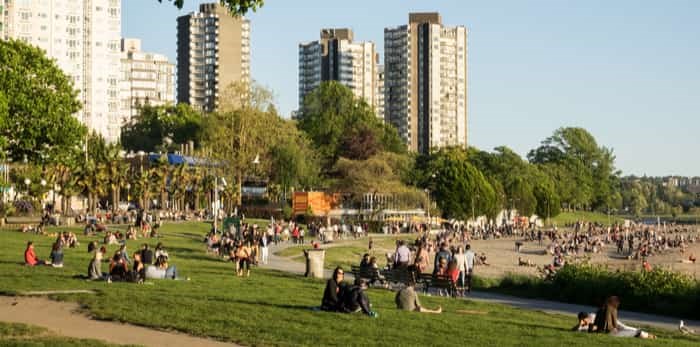  Vancouver Canada, May 2017. People enjoy the sunshine at English bay beach / Shutterstock