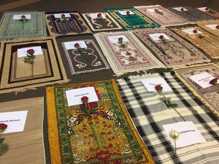  Empty prayer mats symbolizing each person who was killed were laid out at Az-Zahraa Sunday. Photo: Az-Zahraa