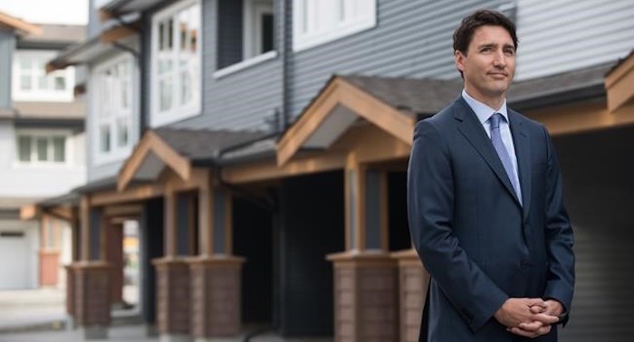  Prime Minister Justin Trudeau listens while being introduced before a post-budget housing announcement at a townhouse development in Maple Ridge, B.C., on Monday March 25, 2019. THE CANADIAN PRESS/Darryl Dyck