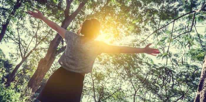  Happy women in forest enjoying nature / Shutterstock