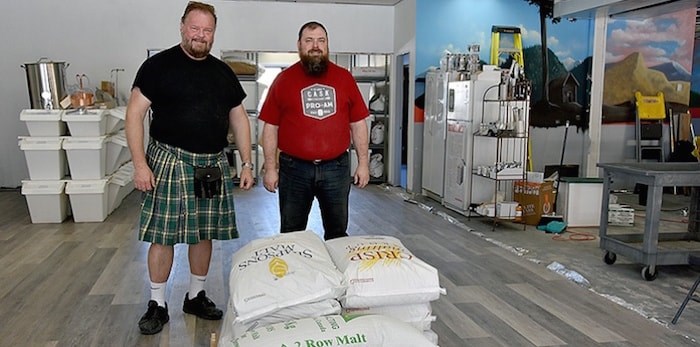  Fraser Mills Fermentation owners Tim Vandergrift (left) and Michael Druce, a Port Moody resident who owns Beyond the Grape. They and the other owners hope to open their craft brewery — the first in PoMo outside of Brewers Row, at 3044 St. Johns St. — in July. Photo by Janis Cleugh/Tri-City News