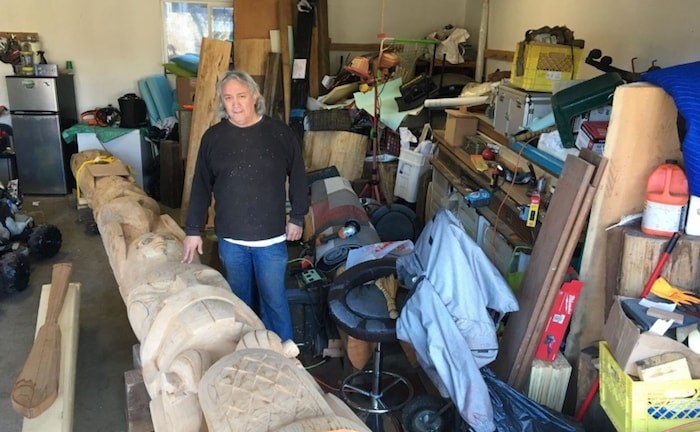  Haida artist Clarence Mills is carving what he thinks will be one of his last totem poles in a friend’s East Van garage. Photo Grant Lawrence