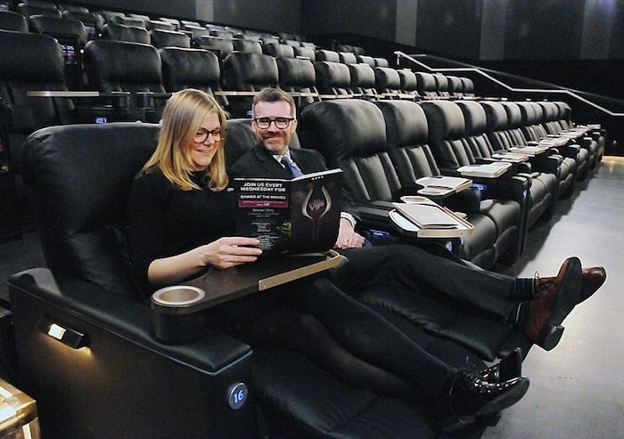  Sarah Van Lange and Ken Mont of Cineplex Entertainment show off the VIP section of the new West Vancouver movie theatre, where moviegoers are encouraged to kick back and order food and beverages to their seats. Photo by Cindy Goodman/North Shore News