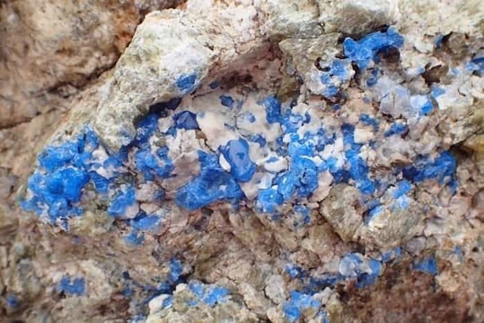  Vivid blue spinel with white carbonate in calc-silicate rock is seen in this undated handout photo. Baffin Island holds some of its treasure in plain sight with rocks that produce rare gems sitting exposed to the elements, scientists say. A new study from the University of British Columbia shows the area is home to a mineral that is prized by jewellers and collectors. Study co-author Philippe Belley said in an interview that cobalt-blue spinel, 