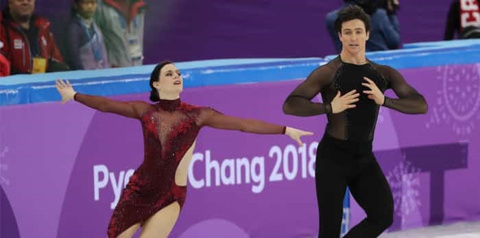  GANGNEUNG, SOUTH KOREA - FEBRUARY 12, 2018: Two time Olympic champions Tessa Virtue and Scott Moir of Canada perform in the Team Event Ice Dance Free Dance at the 2018 Winter Olympic Games / Shutterstock