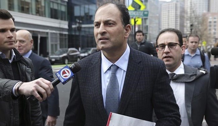  David Sidoo, of Vancouver, Canada, leaves following his federal court hearing Friday, March 15, 2019, in Boston. Sidoo faces an additional charge of conspiracy to commit money laundering for his alleged role in a college admissions scandal in the United States. THE CANADIAN PRESS/AP-The Boston Globe--Jonathan Wiggs