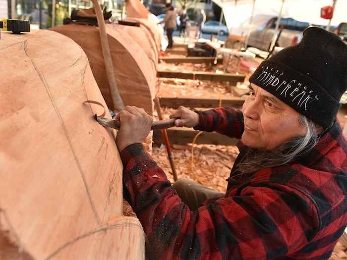  Squamish First Nation artist Xwalacktun is teaming up with his son James Harry and school-aged kids from across Vancouver to carve a 44-foot welcome post that will be erected outside the Vancouver School Board office. Photo by Dan Toulgoet.