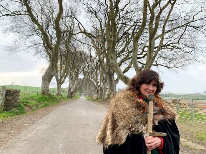  Tour guide Dee Morgan brings her GoT-inspired cloak and sword to the Dark Hedges. Photo Jennifer Bain