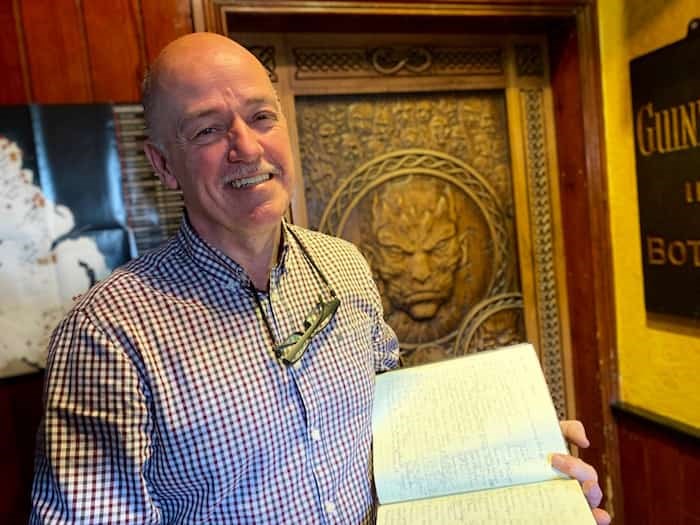  At Owens Bar in Limavady, proprietor Damien Owens loves having one of the Game of Thrones doors that was created from two trees that fell at the Dark Hedges. He has a guestbook he gets Thronies and other guests to sign. Photo Jennifer Bain