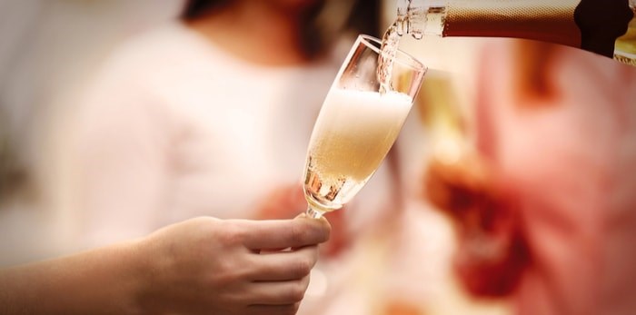  Pouring sparkling wine/Shutterstock