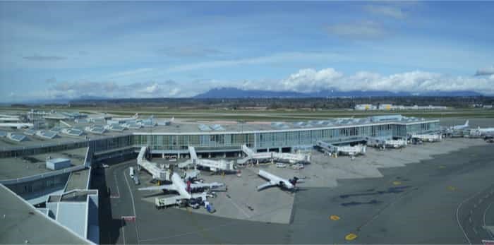  Delta and Air Canada airplanes getting ready for boarding at Vancouver International Airport/Shutterstock