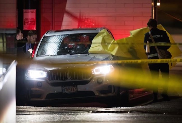 Bullet holes are seen in the windshield and hood of an SUV as a coroner and investigators look into the vehicle in Vancouver, on Wednesday April 17, 2019, after a person was shot and killed Tuesday night. Vancouver Police say the shooting that occurred in the Kitsilano neighbourhood is believed to be targeted and the victim died at the scene. THE CANADIAN PRESS/Darryl Dyck