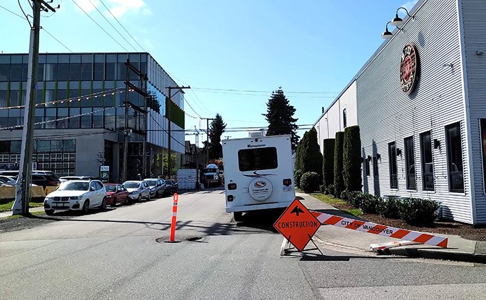  The sinkhole is conveniently located about 10 feet from the sidewalk, offering an obstacle for both pedestrians and cars. Photo Bob Kronbauer