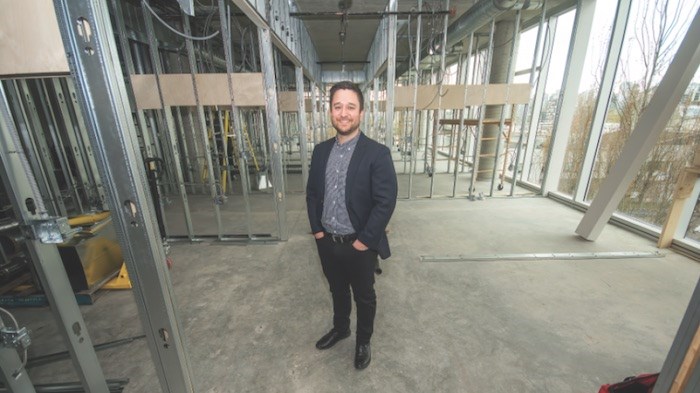  Yosh Kasahara, Pavilion Cowork’s managing director, standing in the corridor of the company’s many unfinished offices. Photo by Chung Chow