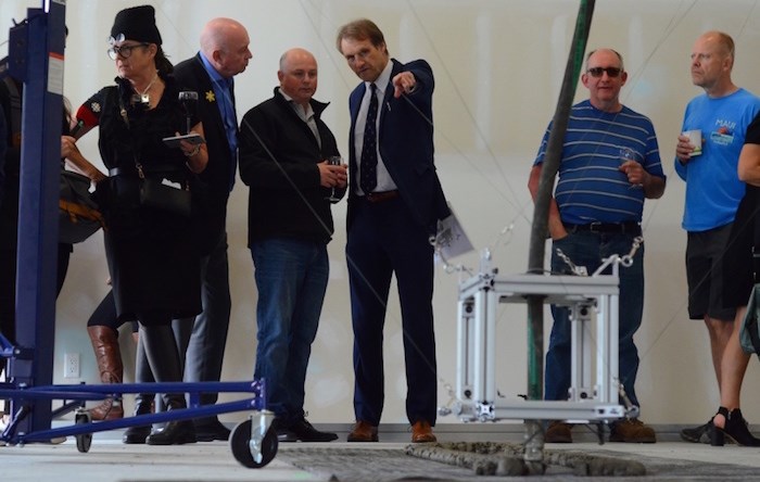  Paul Tinari points to his 3D printer at a open house in Burnaby Thursday. Photo by Cornelia Naylor.