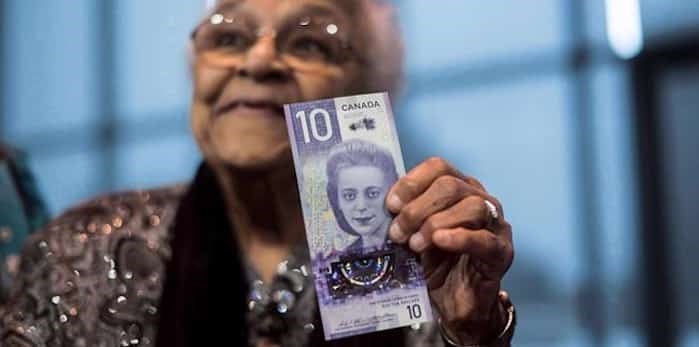  Wanda Robson, sister of Viola Desmond, holds the new $10 bank note featuring Desmond during a press conference in Halifax on Thursday, March 8, 2018. Canada's new $10 bill featuring Nova Scotia human rights icon Viola Desmond has been named bank note of the year.The bill, which also shows a map of Halifax's north end and the Canadian Museum for Human Rights in Winnipeg, was honoured in a vote by the International Bank Note Society. THE CANADIAN PRESS/Darren Calabrese
