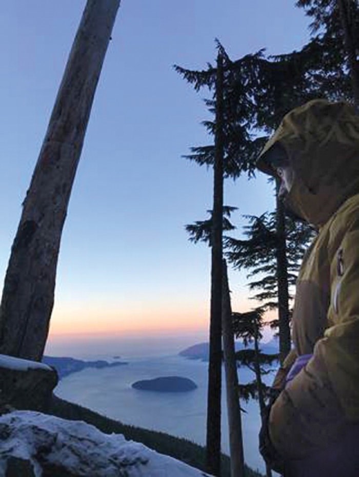  Matt Beer waits to be rescued by helicopter at sunrise on Feb. 9. Photo courtesy Lillith Foxx
