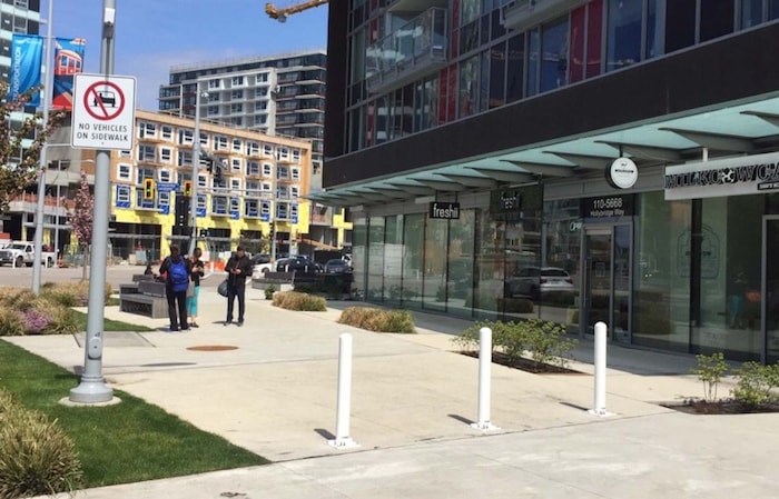  This wide sidewalk was being used as a parking spot, until Thursday. Photo by Alan Campbell.