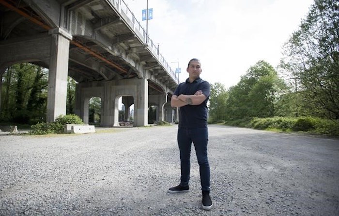  Dustin Rivers or Khelsilem, stands on the land below and next to the Burrard Street Bridge is pictured where the Squamish Nation is proposing a massive housing project in the city of Vancouver, Wednesday, May 1, 2019. THE CANADIAN PRESS/Jonathan Hayward