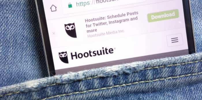  KONSKIE, POLAND - MAY 18, 2018: Hootsuite website displayed on smartphone hidden in jeans pocket / Shutterstock