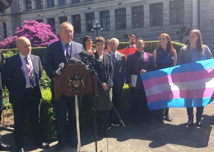  B.C. Green Leader Andrew Weaver, flanked by his two caucus members Adam Olsen and Sonia Furstenau, and members of LGBTQ community, attend a news conference at the legislature in Victoria, Monday, May 27, 2019. BC’s Greens are introducing legislation to ban conversion therapy, which tries to convert homosexuals to heterosexuals. THE CANADIAN PRESS/Dirk Meissner