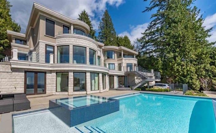  This modern mansion in West Vancouver's British Properties sold for $5.5 million, having been purchased by an investment group for $11.98 million. Image via MLS