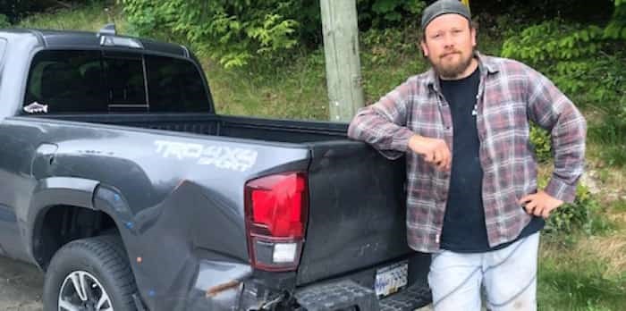  Willis Clarke, a Sunshine Coast carpenter raised in New Westminster, poses beside his pickup, which was rear-ended by a taxi on Highway 1in Burnaby in March. Clarke is fighting ICBC's 50-50 blame assessment.