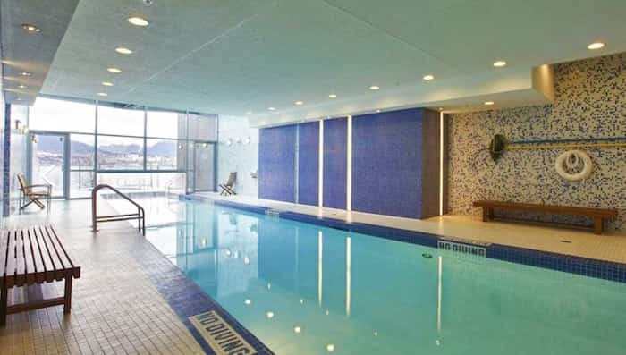  Carina's rare indoor-outdoor swimming pool is a real luxury. Image via REW.ca