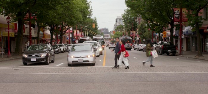  Park and Wong discuss life here in San Francisco while crossing Main Street in Chinatown in Vancouver. Screenshot/Netflix