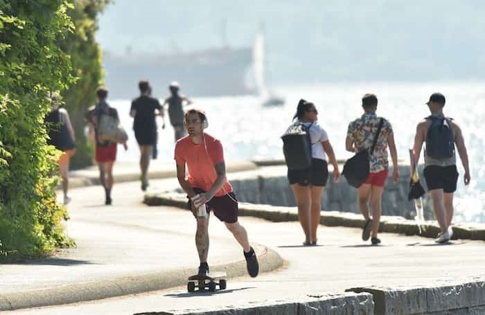  Of the myriad of safety issues found on the Seawall, cyclist speed is at the top of the list along with people travelling the wrong way. In this photo, the skateboarder is not only on the pedestrian path, he's also travelling the wrong direction on what is a one-way portion of the Seawall. Photo Dan Toulgoet.