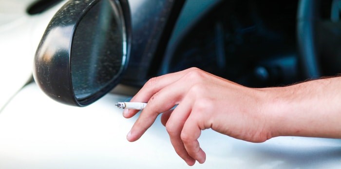  Smoking a cigarette in the car/Shutterstock