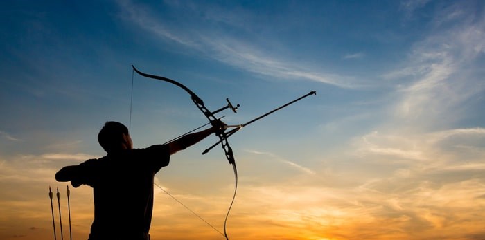  Shooting with a bow and arrow/Shutterstock