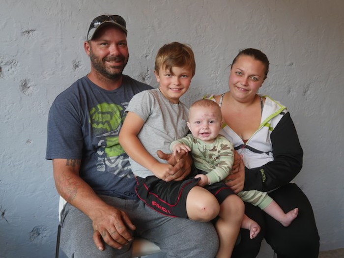  From left to right, Adam Hill, Ty Cissell, Kade Hill and Amber Cissell on June 12, less than two weeks after Kade was bitten by their family dog. Photo submitted