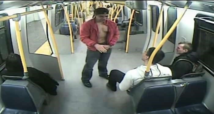  A screenshot of SkyTrain security video shows Taitusi Vikilani, in red, and Jesse Sellam, seated in white, on a train headed toward Edmonds station the night James Enright was stabbed to death. - Screenshot