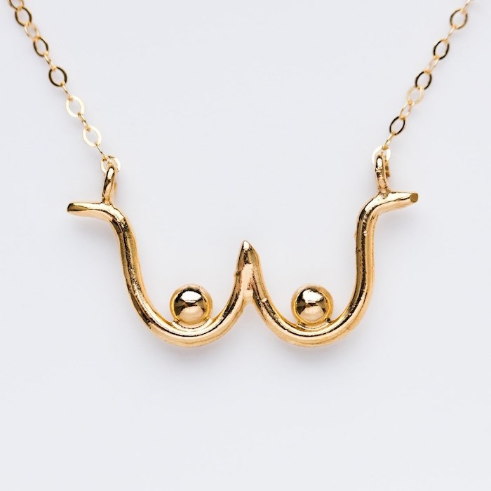  In the fall of 2016, Wolf Circus released a necklace depicting the outline of a woman’s breasts. “A few months later,  Trump gets elected and then  the boob necklace just totally picked up and really put our brand on the map.” Photo courtesy Wolf Circus