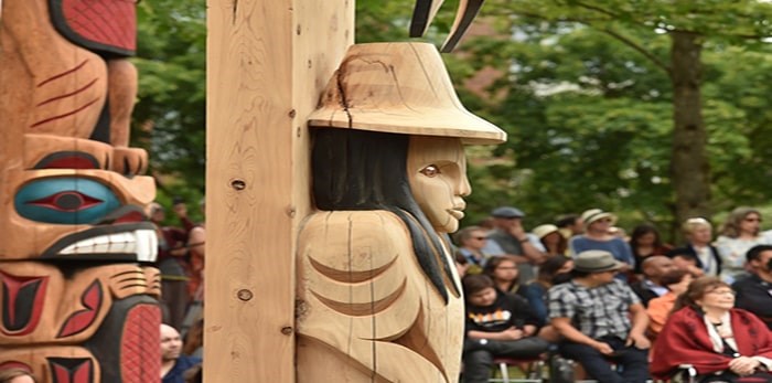  The unveiling of three massive welcome posts carved by members of the Squamish and Musqueam First Nations. Photo: Dan Toulgoet