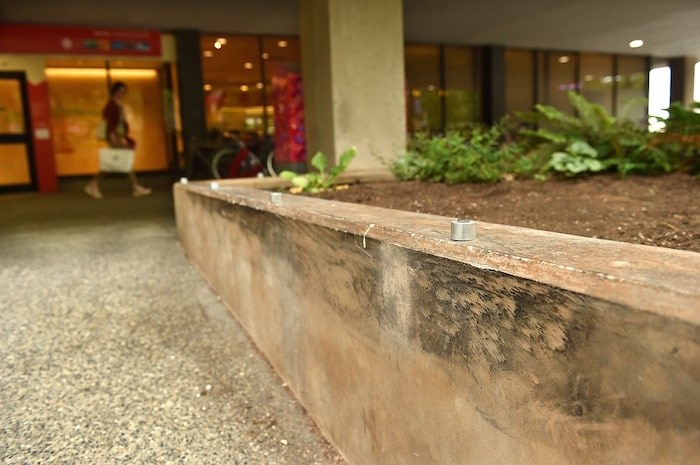  Metal clamps have been fastened to curbs, ledges and other surfaces across the city rendering once-popular skate spots obsolete. Photo by Dan Toulgoet/Vancouver Courier