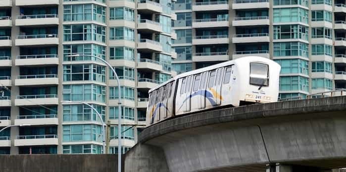  SkyTrain cars turn a corner at Gilmore station in Burnaby.