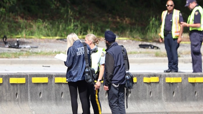  Police investigators on scene after a cyclist was struck by a driver Saturday afternoon on Gaglardi Way. The cyclist has since died. Photo by Shane MacKichan