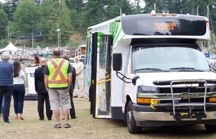  For the next two months, Bowen will have an on-demand bus service on weekday evenings and weekends. The two shuttle buses in the pilot program look like the one in the photo above. Photo by Bronwyn Beairsto/Bowen Island Undercurrent