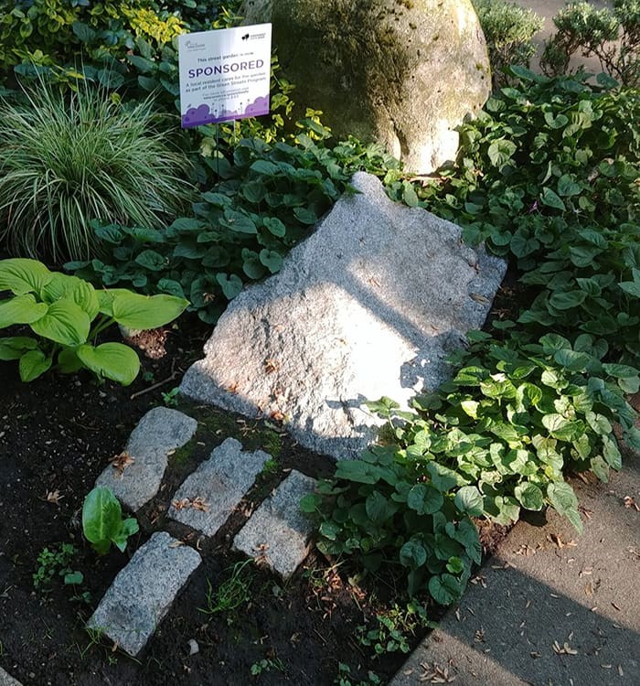  The granite markers at the intersection of West 11th and Maple Street symbolize a gateway to the Arbutus Greenway. Photo: Réjean Beaulieu