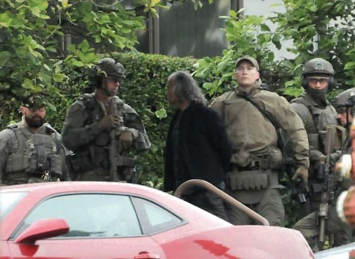  A man is taken into custody by heavily armed police offers following a standoff on the steps of the North Vancouver courthouse Wednesday, July 10. Photo: Mike Wakefield / North Shore News