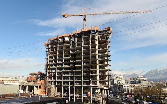  Over the past four years, photographer Dan Touloget has visited the construction site of the Independent more than 50 times to document the progress of the controversial 21-storey building and its growing presence in Mount Pleasant. Photo by Dan Toulgoet/Vancouver Courier