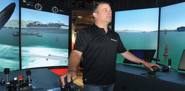  Master Tony Poole takes the helm inside Seaspan’s brand new tug simulator training tool. Photo: Paul McGrath, North Shore News