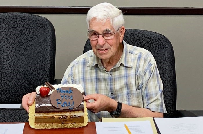  Longtime community policing volunteer Ray Allen celebrates with cake on his last day with the community policing advisory committee. - Burnaby RCMP