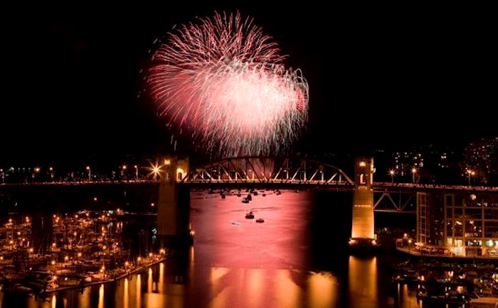  The Burrard Street Bridge is seen in the foreground as fireworks from team China blast over the waters of English Bay during the 21st annual Celebration of Light in Vancouver, Saturday, July 30, 2011. Vancouver's 29th annual fireworks extravaganza is set to showcase the pyrotechnical skills of India, Croatia and Canada as the three countries light up the sky this summer. THE CANADIAN PRESS/Jonathan Hayward